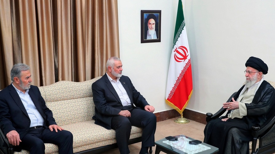 Iranian Supreme Leader Ayatollah Ali Khamenei (R) met Hamas chief Ismail Haniyeh (C) and the leader of the Palestinian Islamic Jihad group Ziad Nakhaleh in Tehranon Tuesday, July 30. (Image: Office of the Iranian Supreme Leader via AP)