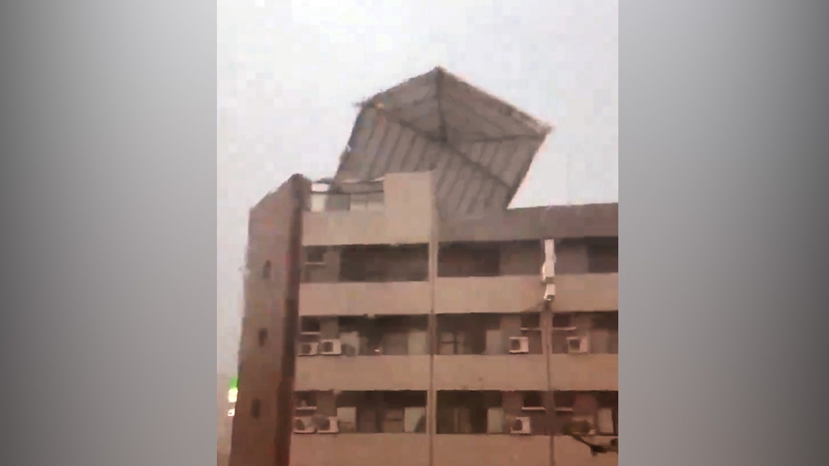 Typhoon Gaemi's gusty winds push moving car backwards, rips off roof